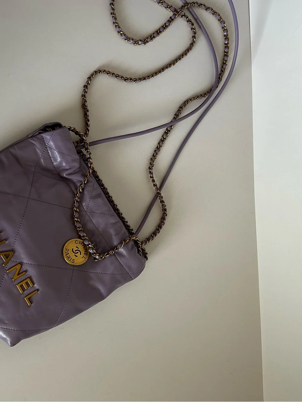 CHANEL Mini 22 Lavender Quilted Leather Crossbody with Gold Logo Medallion
